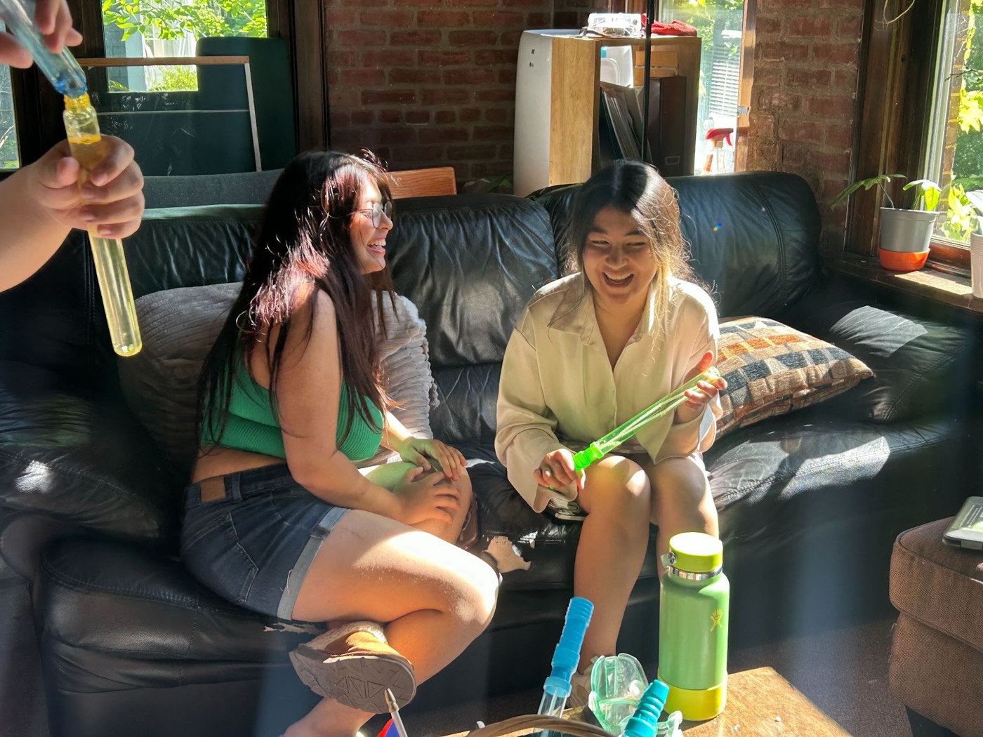 Housemates laughing together in the Lodge common room